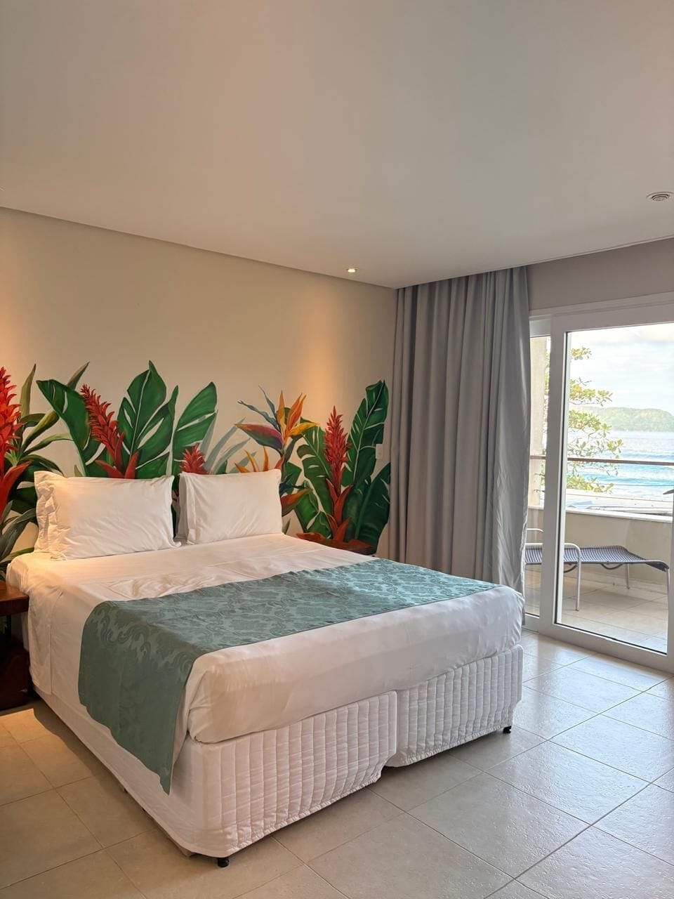 Luxury Room, Patio, Sea View | Minibar, in-room safe, soundproofing, bed sheets