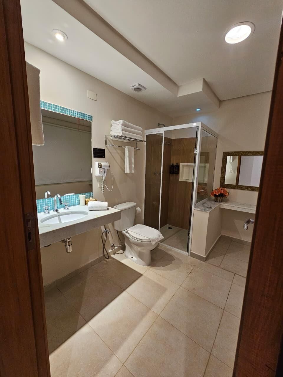 Luxury Room, Patio, Sea View | Bathroom | Shower, hair dryer, towels