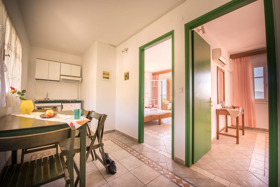 Apartment, 2 Bedrooms | Private kitchen | Fridge, stovetop, electric kettle, highchair