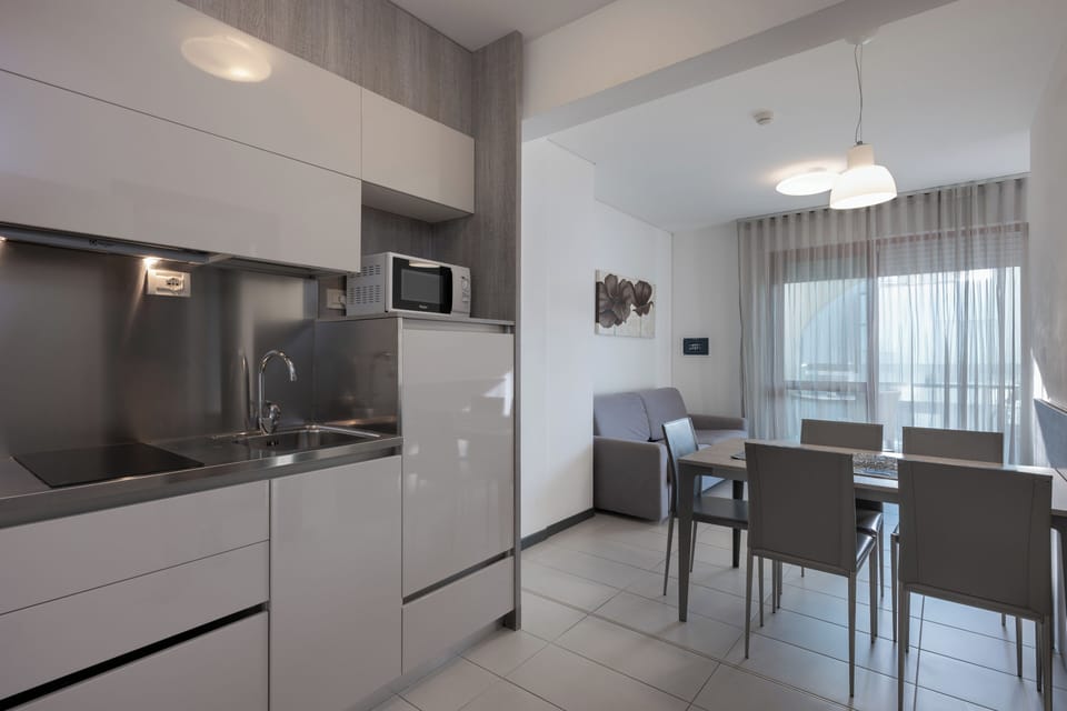 Apartment, Balcony | Private kitchen | Mini-fridge, microwave, stovetop, highchair