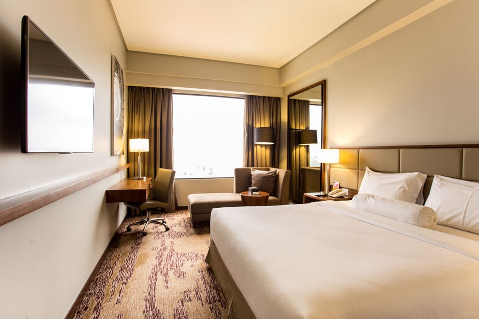 Superior Room | Minibar, in-room safe, desk, blackout drapes