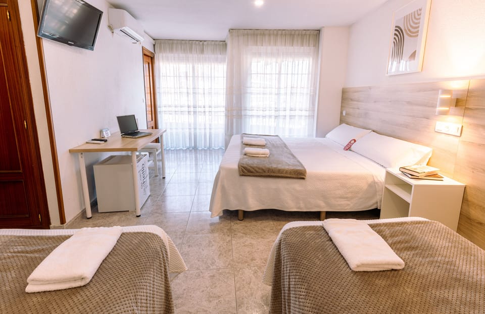 Family Quadruple Room | In-room safe, blackout drapes, free WiFi, bed sheets