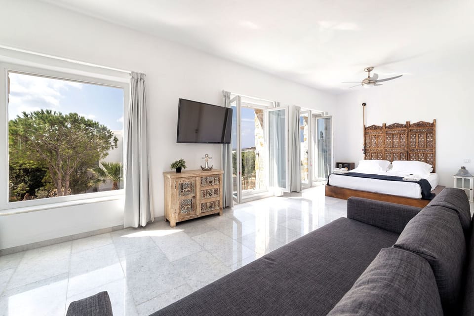 Luxury Villa, Poolside | Living area | 36-inch flat-screen TV with satellite channels, TV