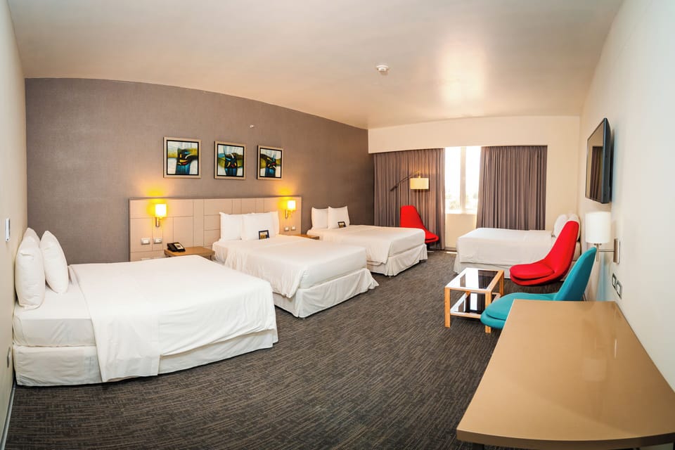 Family Room | Minibar, in-room safe, desk, laptop workspace