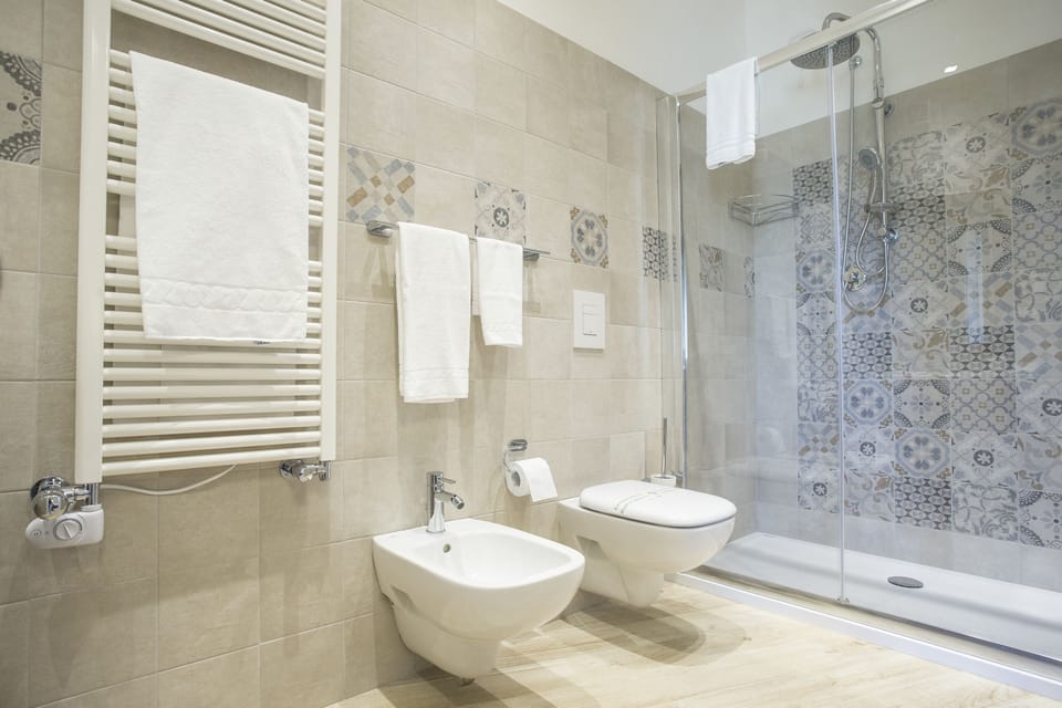 Deluxe Double Room, 1 Queen Bed, Balcony | Bathroom | Shower, free toiletries, hair dryer, slippers