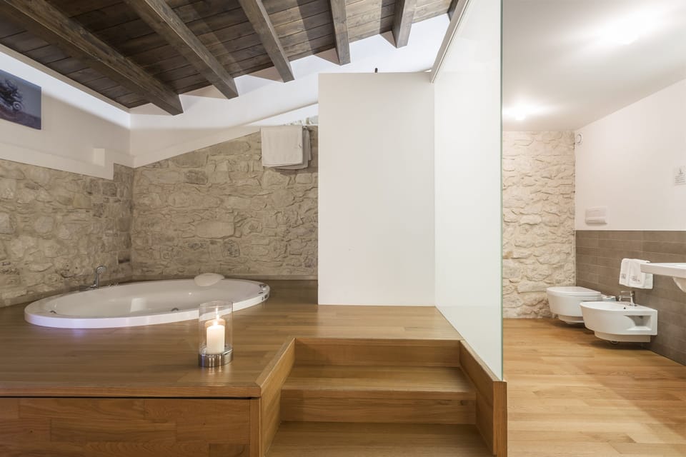 Suite | Bathroom | Rainfall showerhead, hair dryer, bathrobes, slippers