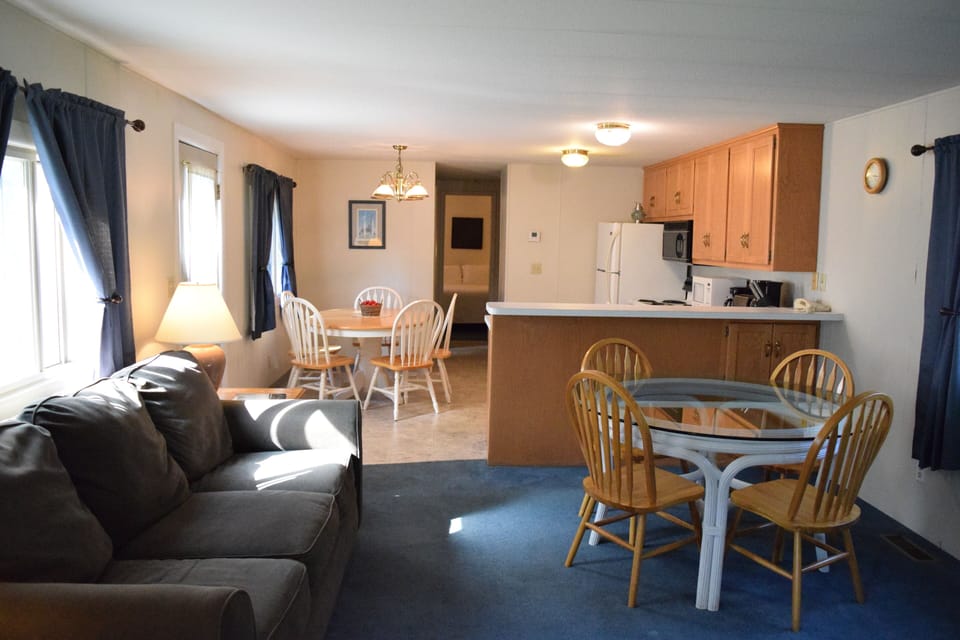 Deluxe Guest House | Living area | Flat-screen TV