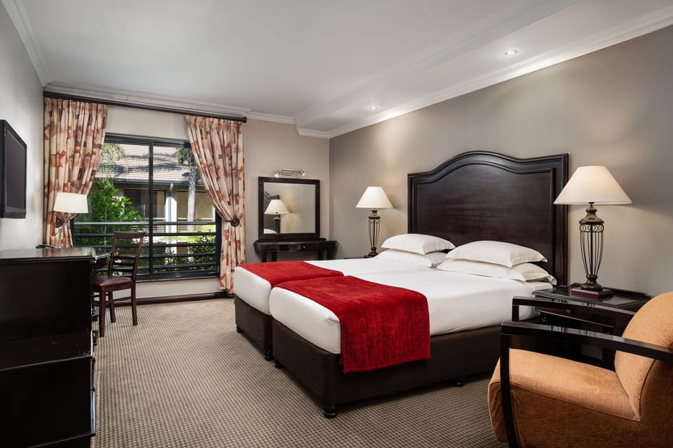 Family Suite, 2 Double Beds | Premium bedding, down comforters, pillowtop beds, in-room safe