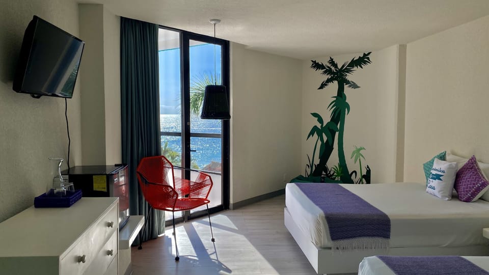 Deluxe Doble Vista Parcial al Mar | In-room safe, blackout drapes, iron/ironing board, free WiFi