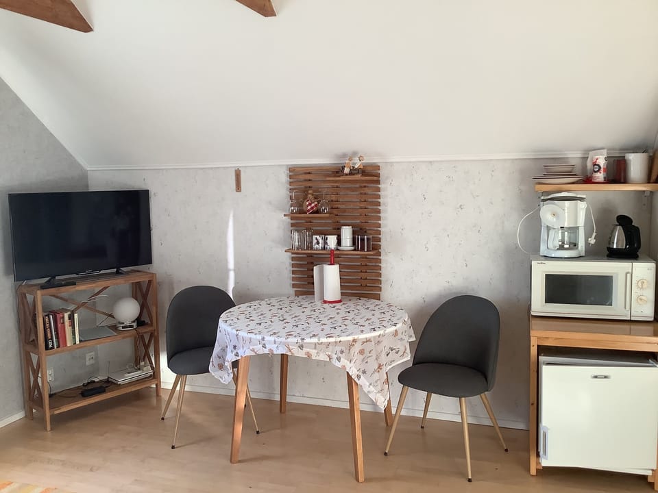Double Room | Living area | Flat-screen TV, heated floors