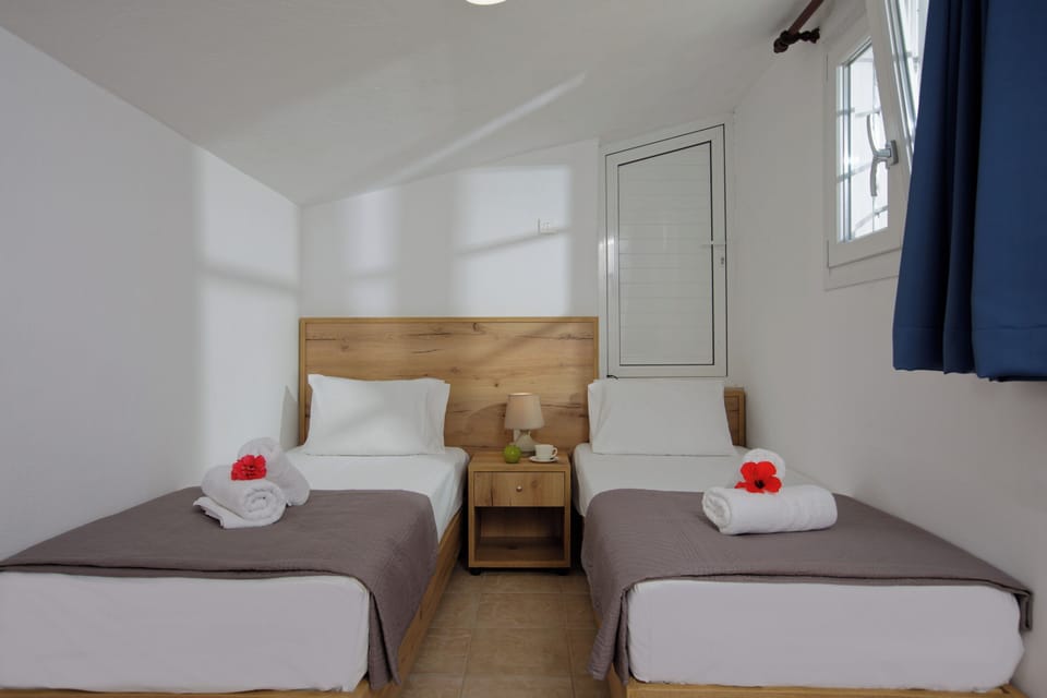 Apartment, 2 Bedrooms, Garden View | 1 bedroom, blackout drapes, iron/ironing board, free WiFi