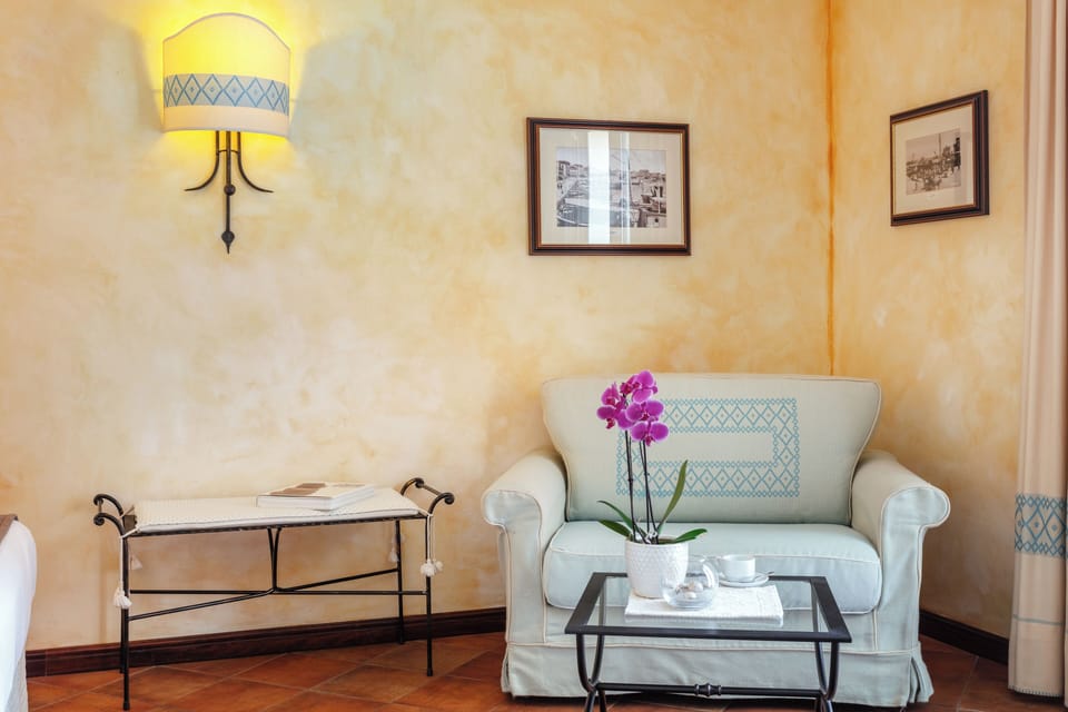 Classic Triple Room, Courtyard View | Minibar, in-room safe, individually decorated, individually furnished