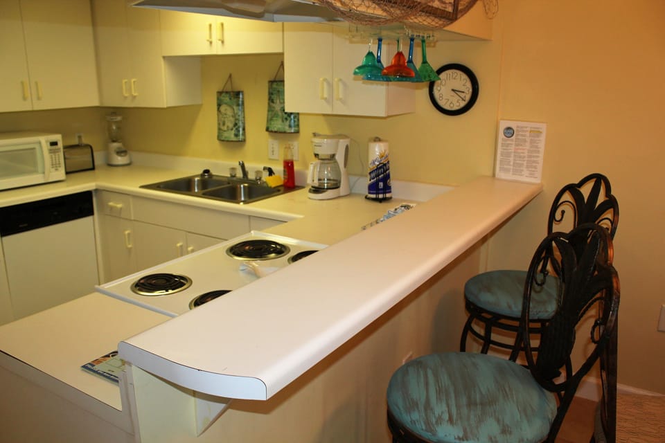 Condo, 1 Bedroom, Balcony, Beachfront | Private kitchen | Full-size fridge, microwave, oven, stovetop