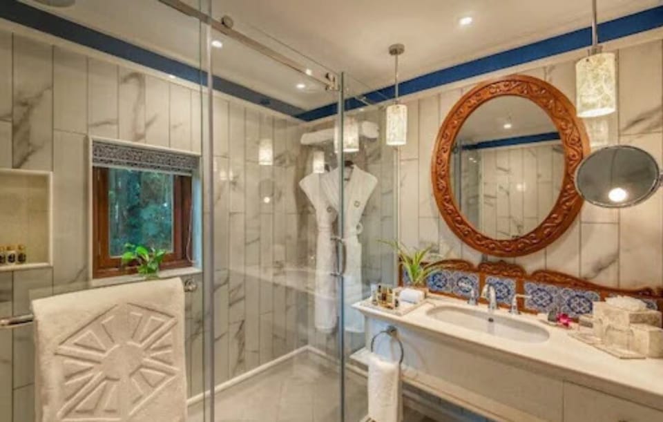 Separate tub and shower, designer toiletries, hair dryer, bathrobes