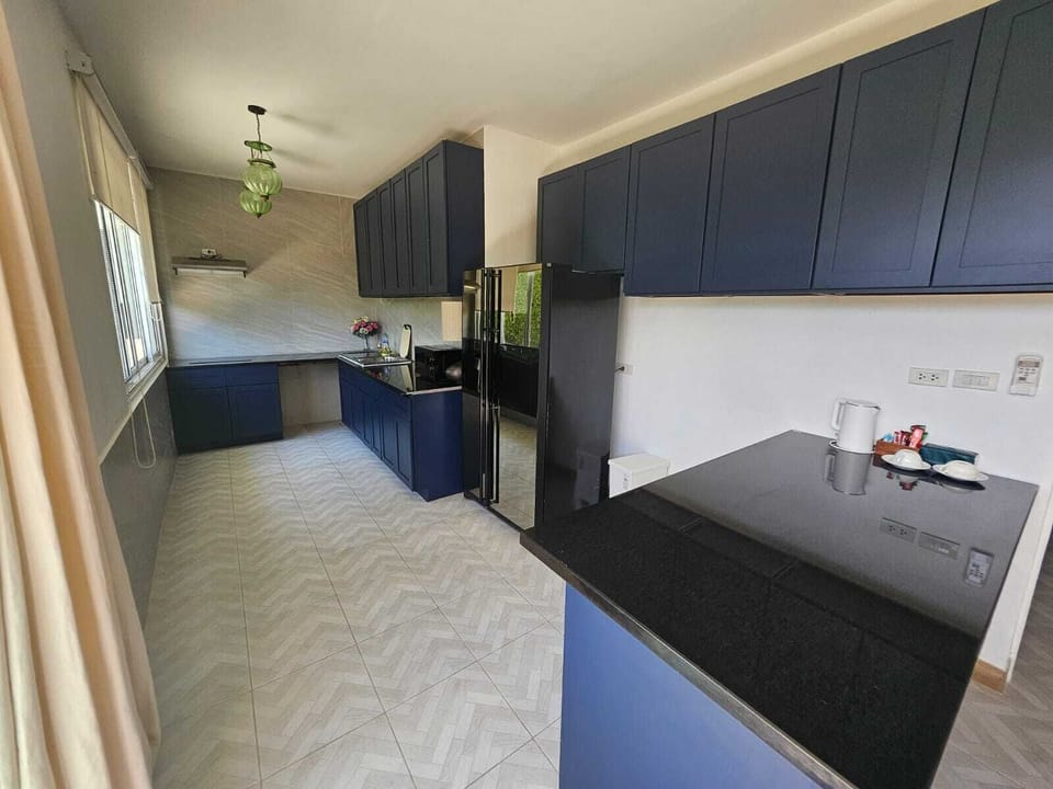 Family Suite 3 bedrooms | Private kitchen | Electric kettle, paper towels, dining table