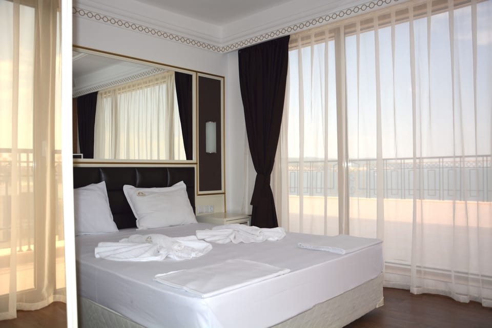 Apartment, 1 Bedroom, Balcony, Partial Sea View | Blackout drapes, iron/ironing board, free cribs/infant beds, free WiFi