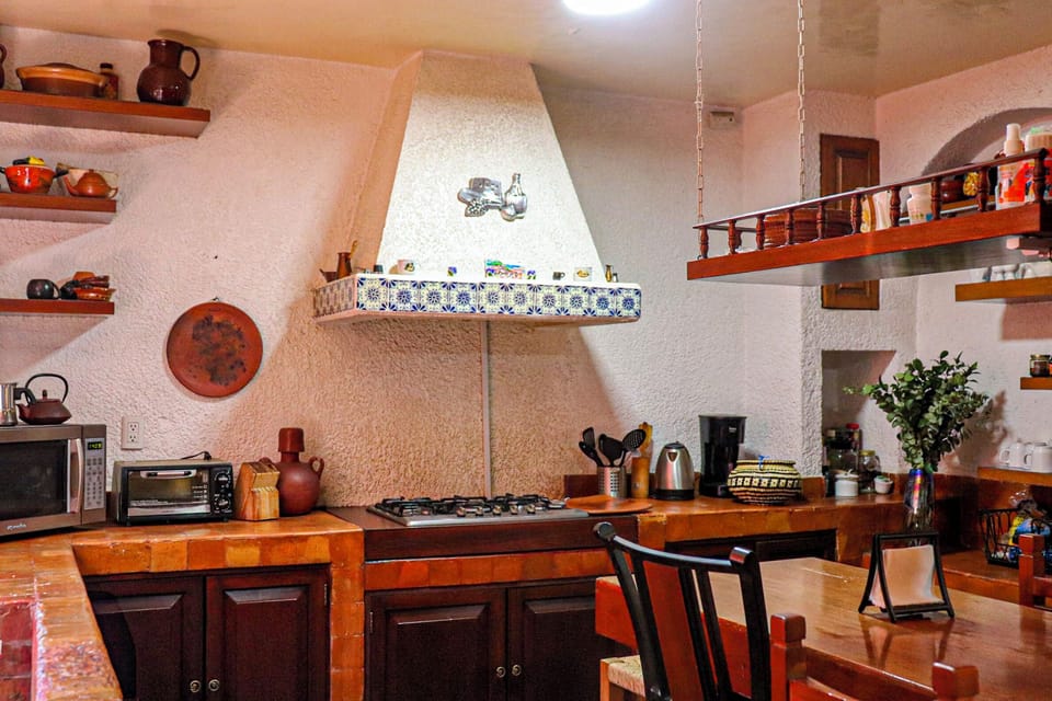 Shared fridge, microwave, cookware/dishes/utensils, dining tables