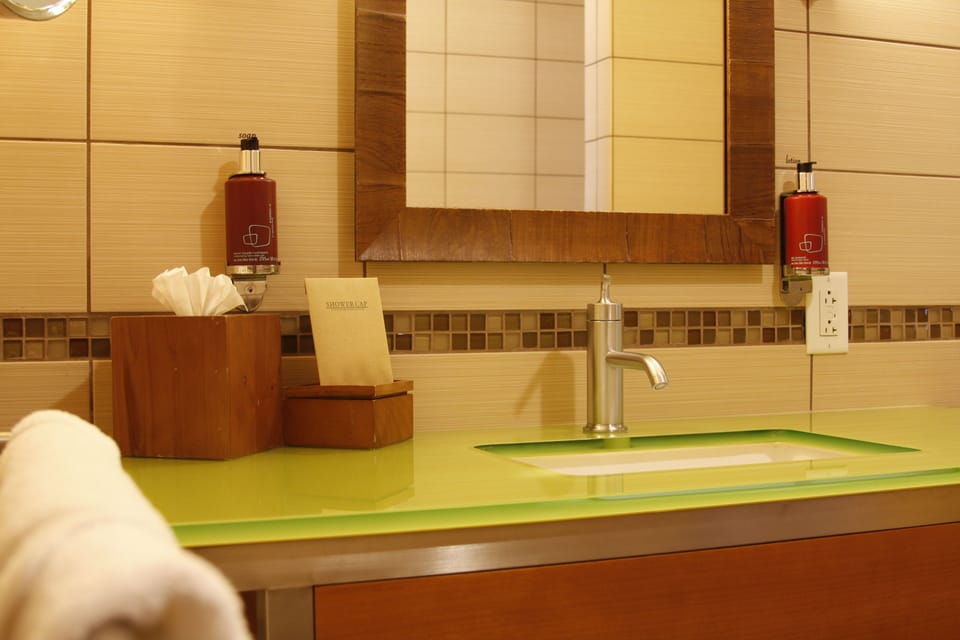Combined shower/tub, designer toiletries, hair dryer, bathrobes