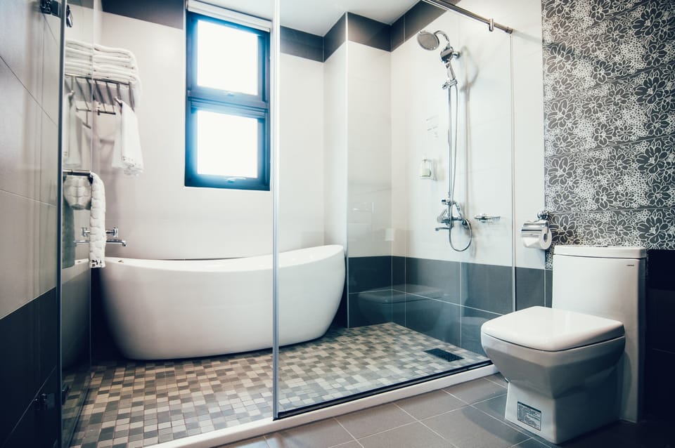 Quadruple Room | Bathroom | Designer toiletries, hair dryer, slippers, towels