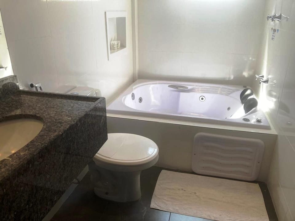 Deluxe Double Room, 1 King Bed, Jetted Tub | Minibar, laptop workspace, blackout drapes, iron/ironing board