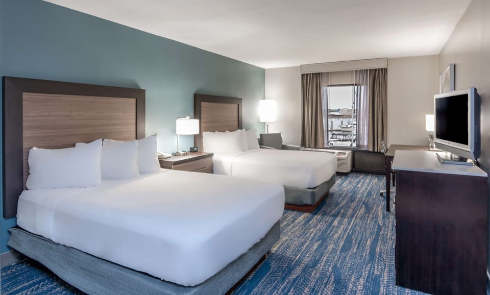 Premium bedding, down comforters, pillowtop beds, in-room safe
