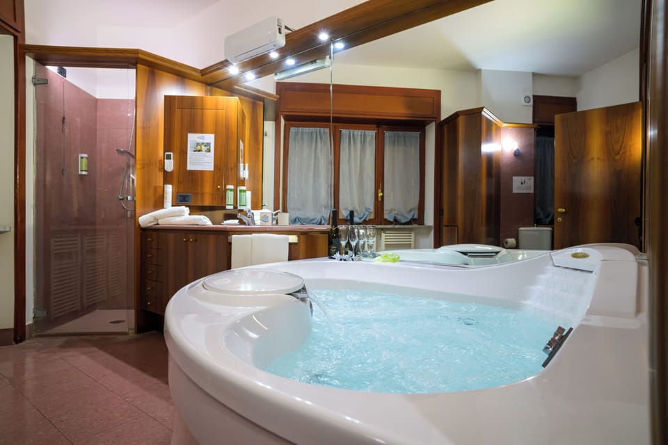 Executive Suite, 1 Bedroom | Bathroom | Eco-friendly toiletries, hair dryer, bathrobes, bidet