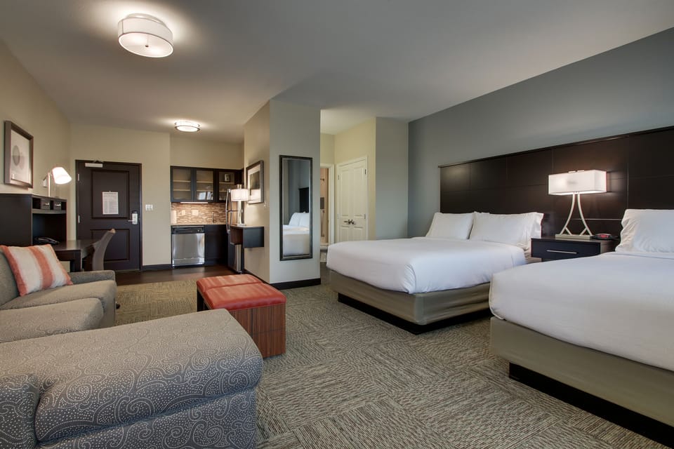 Premium bedding, desk, laptop workspace, soundproofing