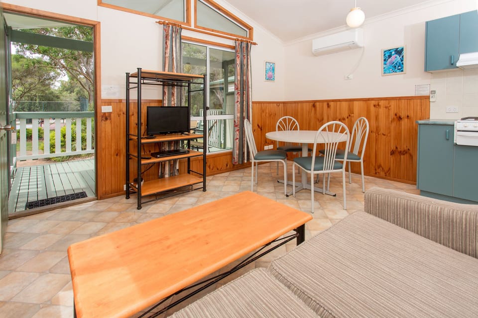Lifestyle Cabin - 1 Queen, 1 Bunk and 1 Single | Living area | TV
