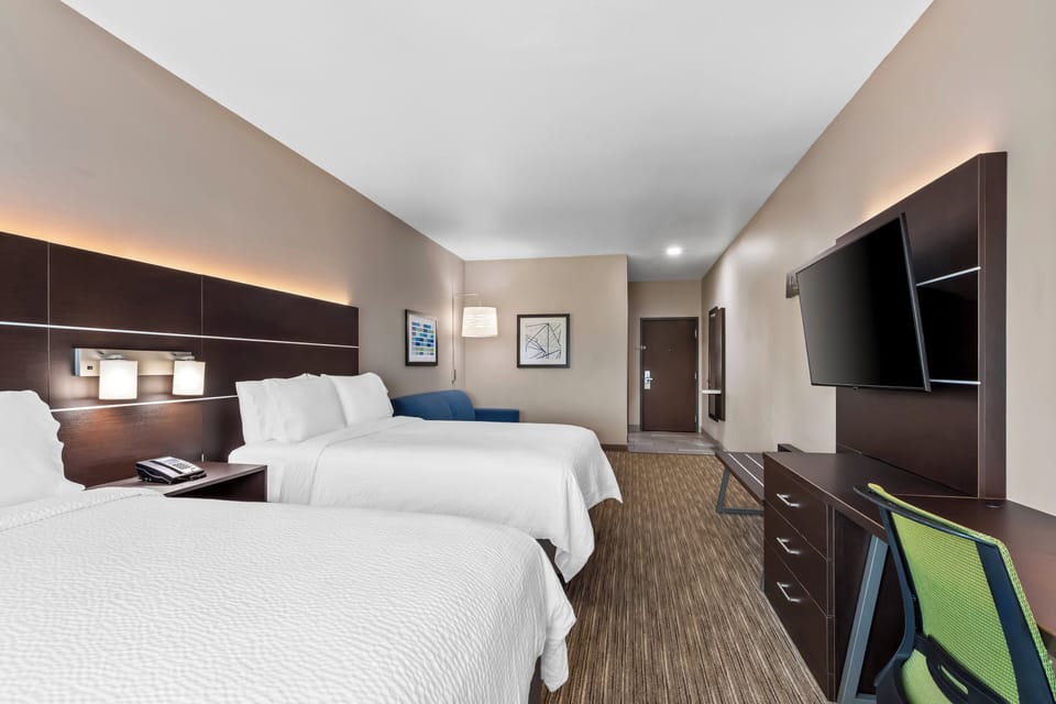 Suite, 2 Queen Beds (Additional Living Area) | Desk, blackout drapes, iron/ironing board, free cribs/infant beds
