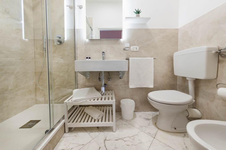 Comfort Room, 1 Queen Bed with Sofa bed, Private Bathroom, Garden View | Bathroom | Shower, free toiletries, hair dryer, slippers