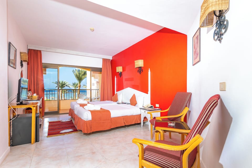 Superior Double or Twin Room, Sea View | Minibar, in-room safe, desk, blackout drapes