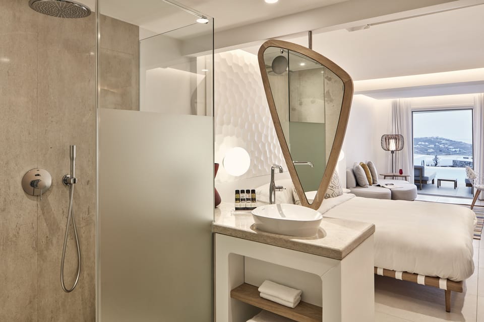 Shower, rainfall showerhead, designer toiletries, hair dryer