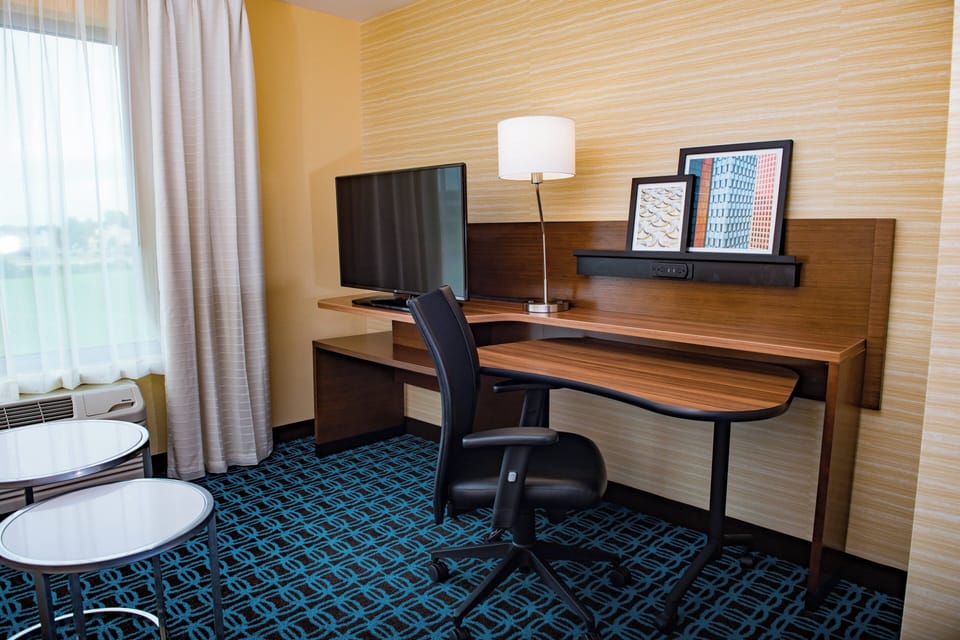 Desk, laptop workspace, blackout drapes, iron/ironing board