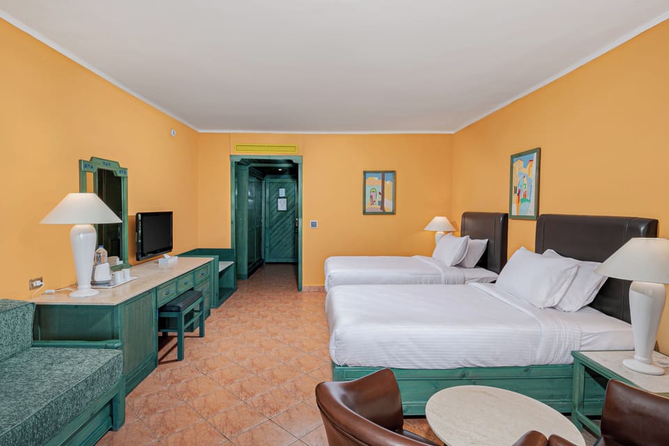 Standard Room, Pool View | Free minibar, in-room safe, WiFi, bed sheets