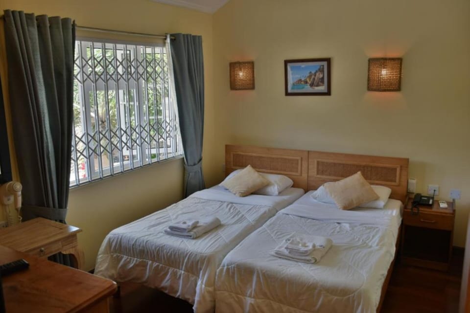 Twin Room | Minibar, desk, iron/ironing board, free WiFi
