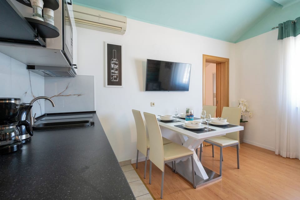 Apartment, Sea View | Living area | Plasma TV