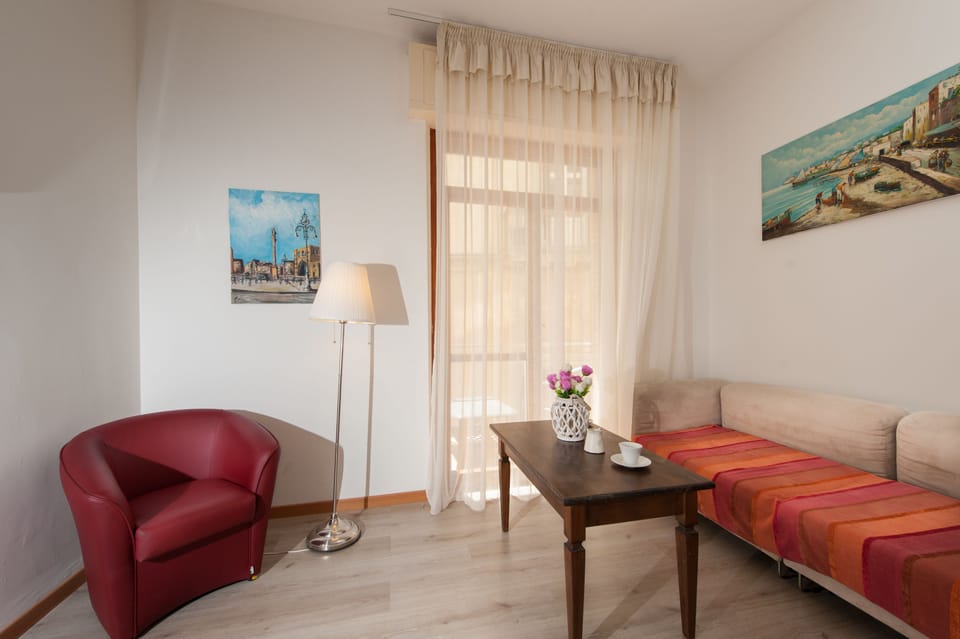 Family Apartment, Kitchen | Living area | Flat-screen TV
