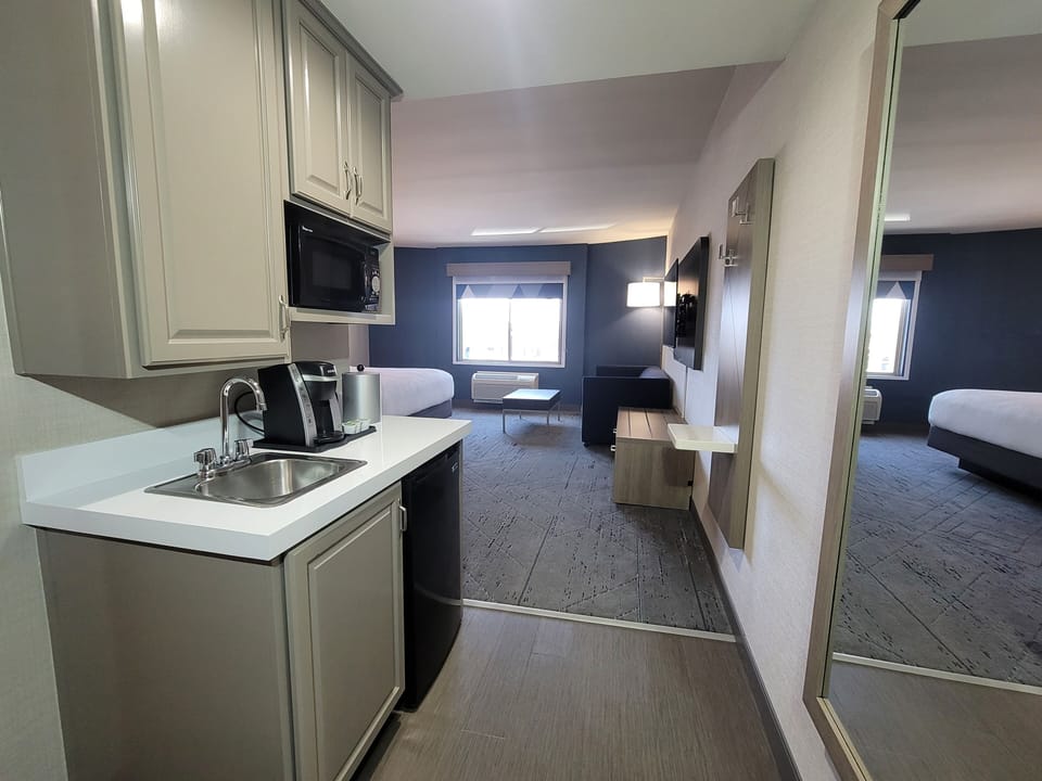 Suite, 1 Bedroom | Desk, blackout drapes, iron/ironing board, free WiFi