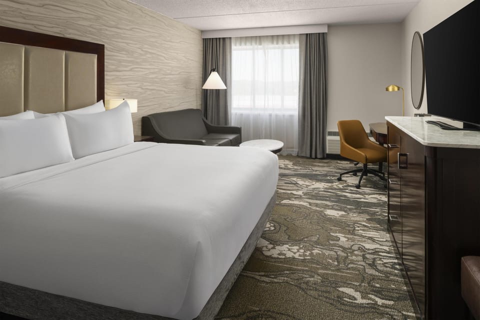 Room, 1 King Bed with Sofa bed | Living area | 55-inch flat-screen TV with cable channels, TV, Netflix
