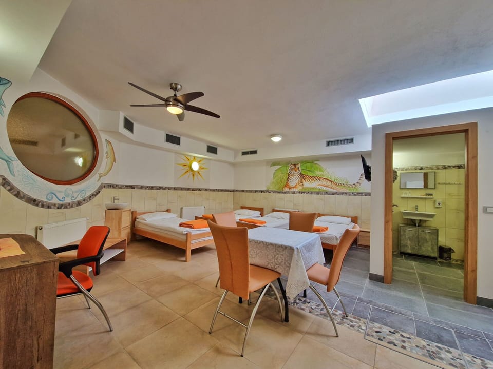 Economy Quadruple Room with Private Bathroom - Basement | Minibar, in-room safe, blackout drapes, soundproofing