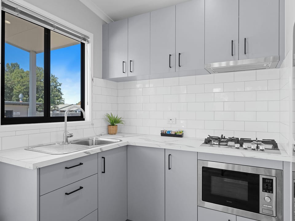 Deluxe 2 Bedroom Villa - Not Pet Friendly | Private kitchen | Shared fridge, microwave, stovetop, electric kettle