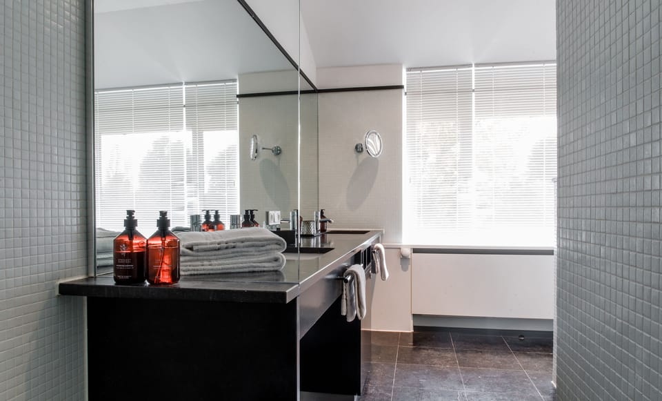 Suite, Balcony, River View (Johann Wolfgang) | Bathroom | Combined shower/tub, designer toiletries, bathrobes, slippers