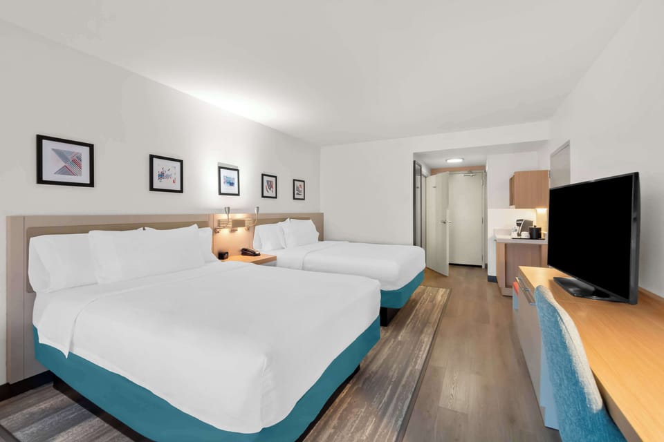 Room, 2 Queen Beds, Non Smoking | Premium bedding, in-room safe, blackout drapes, iron/ironing board