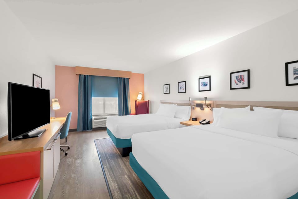 Room, 2 Queen Beds, Non Smoking | Premium bedding, in-room safe, blackout drapes, iron/ironing board