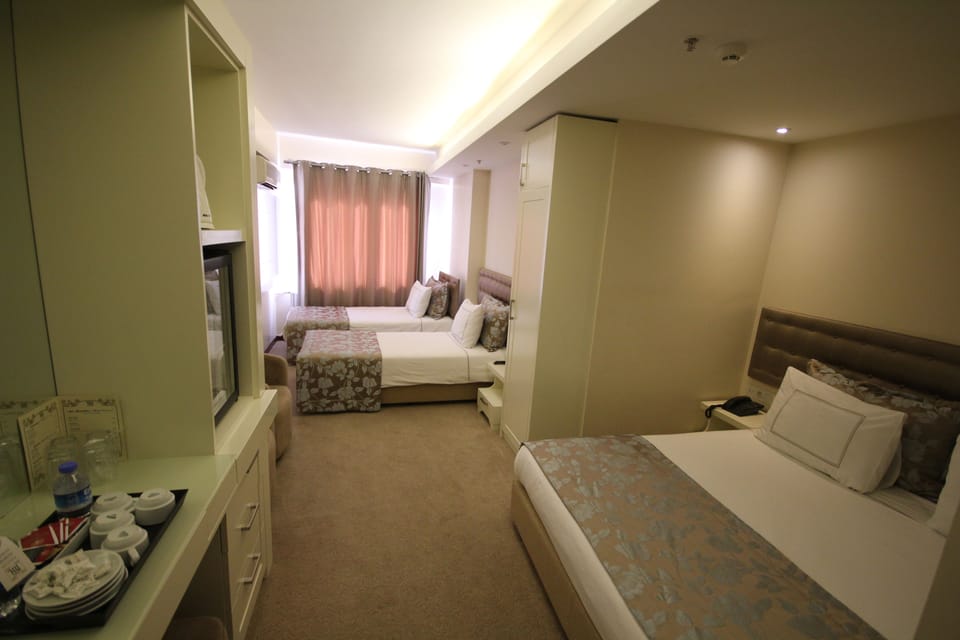 Family Room | Minibar, in-room safe, soundproofing, iron/ironing board