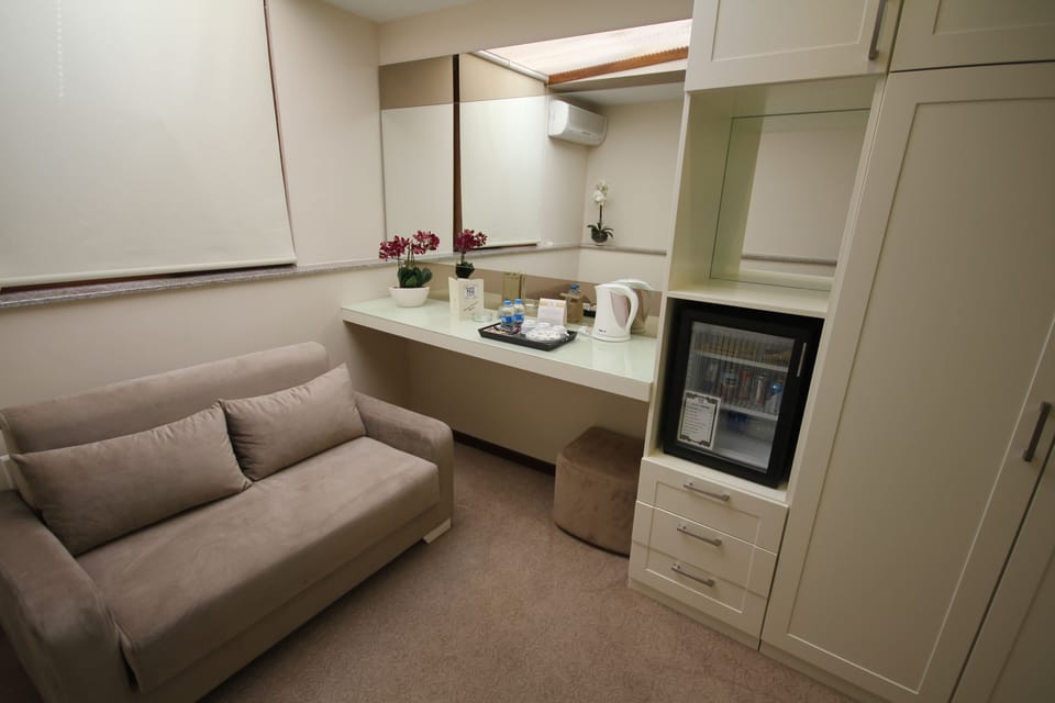 Triple Room | Living area | Flat-screen TV