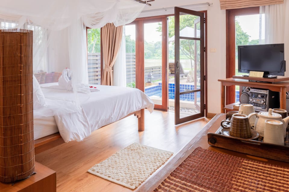 Two-Bedroom Pool Villa | Minibar, in-room safe, individually decorated, individually furnished