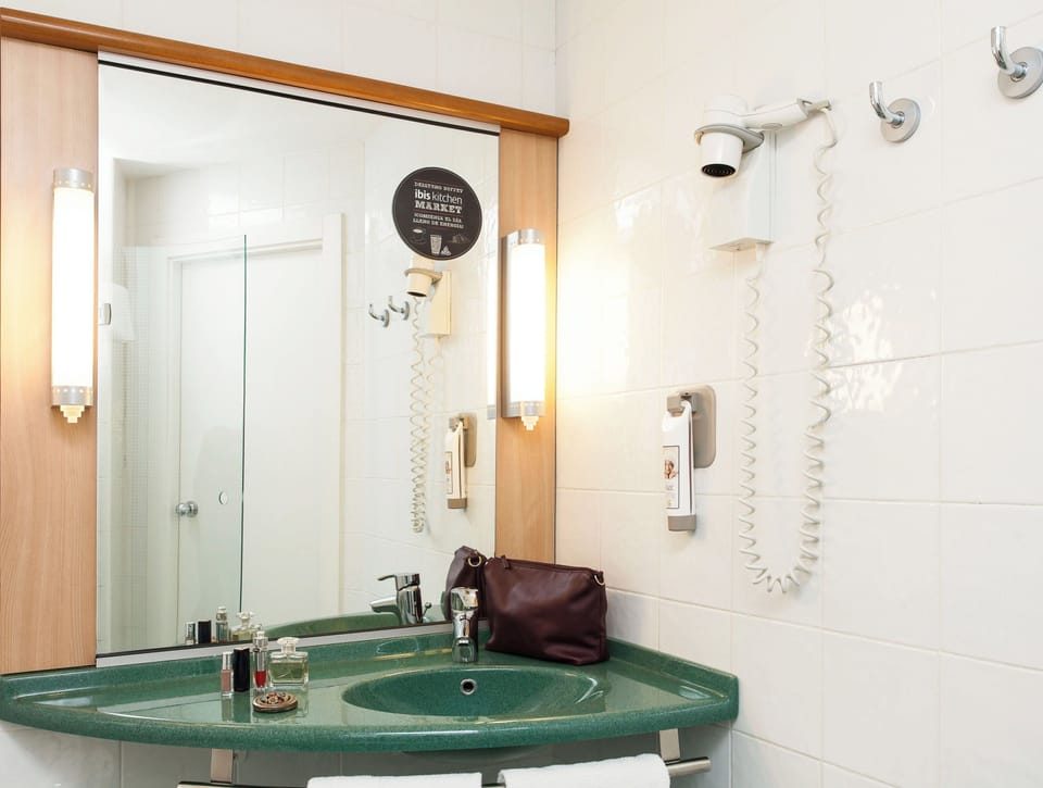 Shower, eco-friendly toiletries, hair dryer, towels