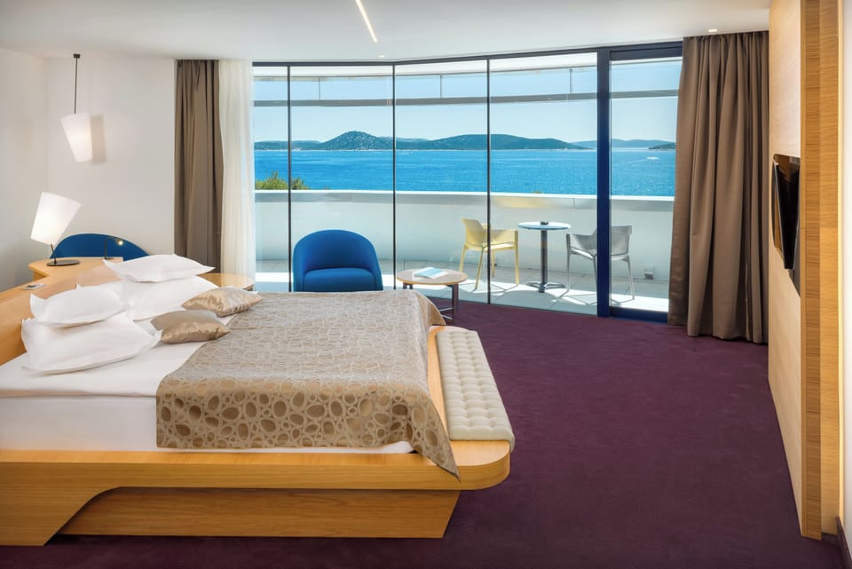 Deluxe Double or Twin Room, Balcony, Sea View | Minibar, in-room safe, desk, soundproofing