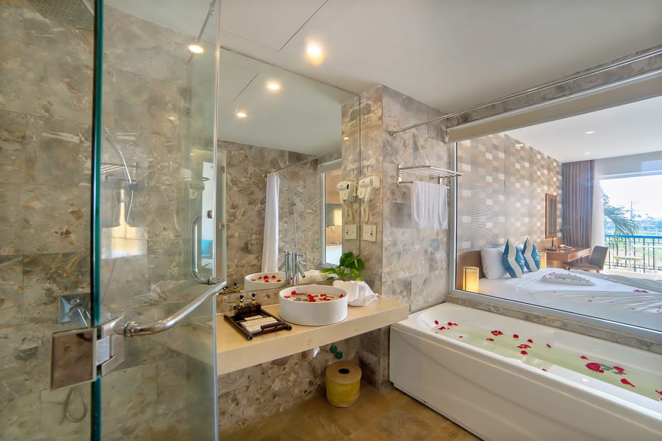 Designer toiletries, hair dryer, bathrobes, slippers